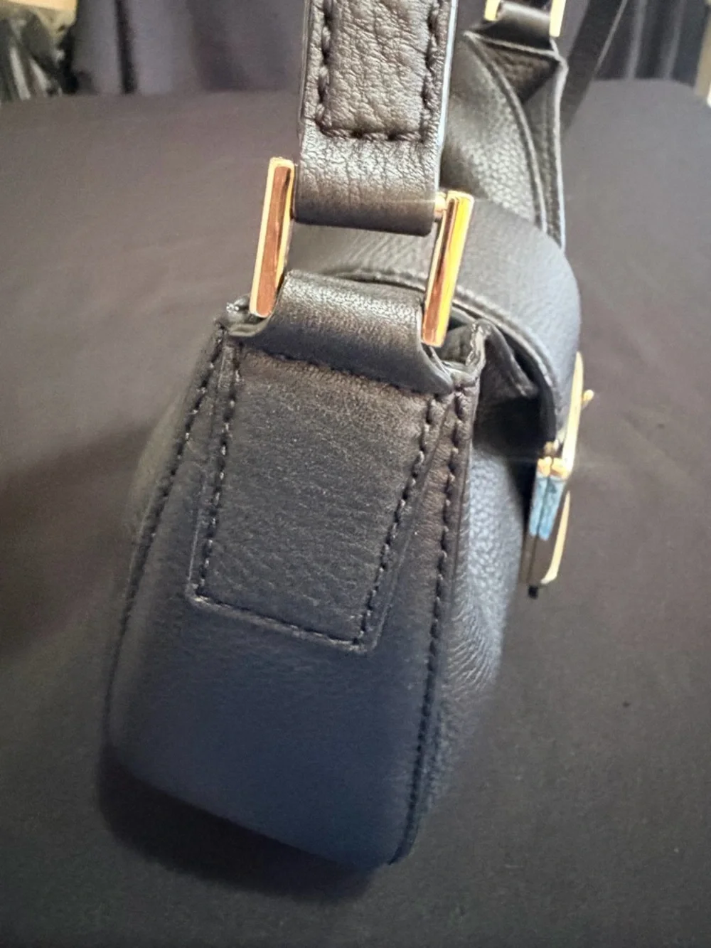 Kate Spade Black Saddle Bag Like New Condition. Very stylish and comfortable.